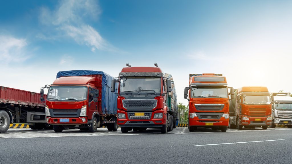 A company fleet of trucks parked in a row