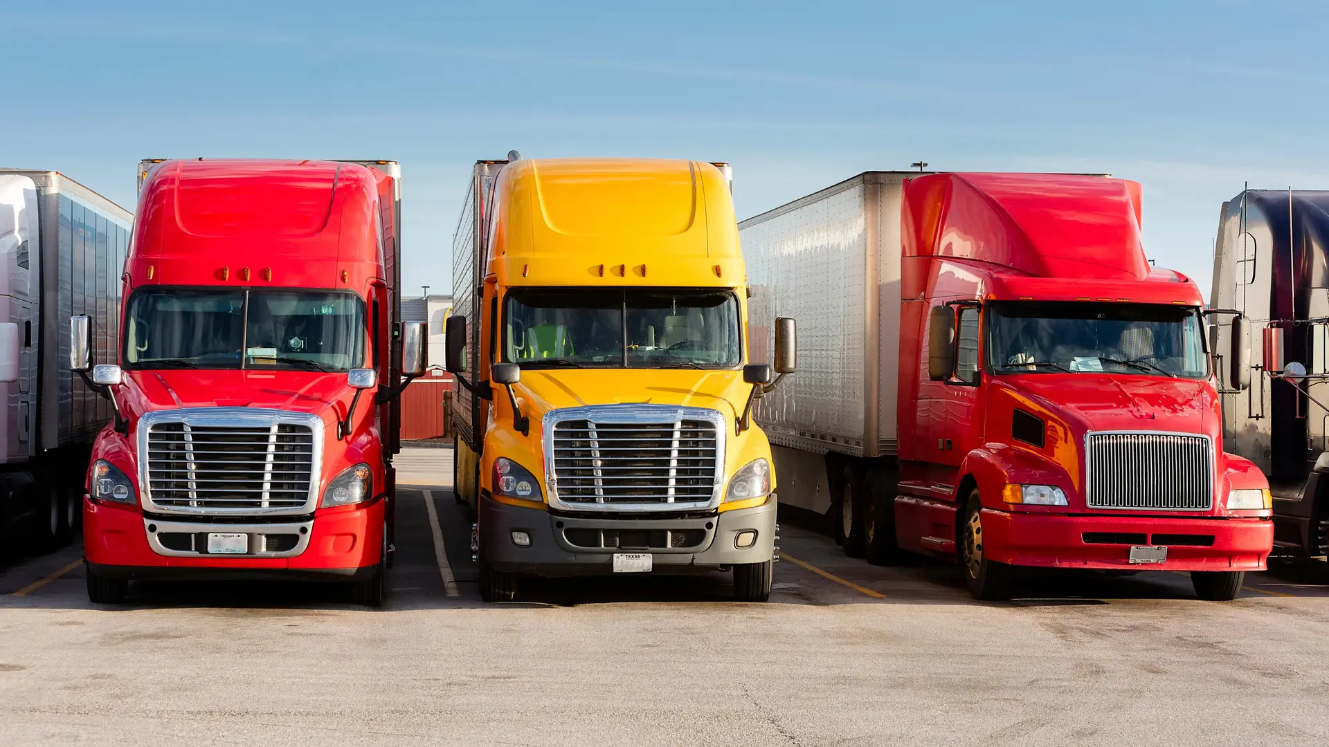 Bobtail tractors parked in a row